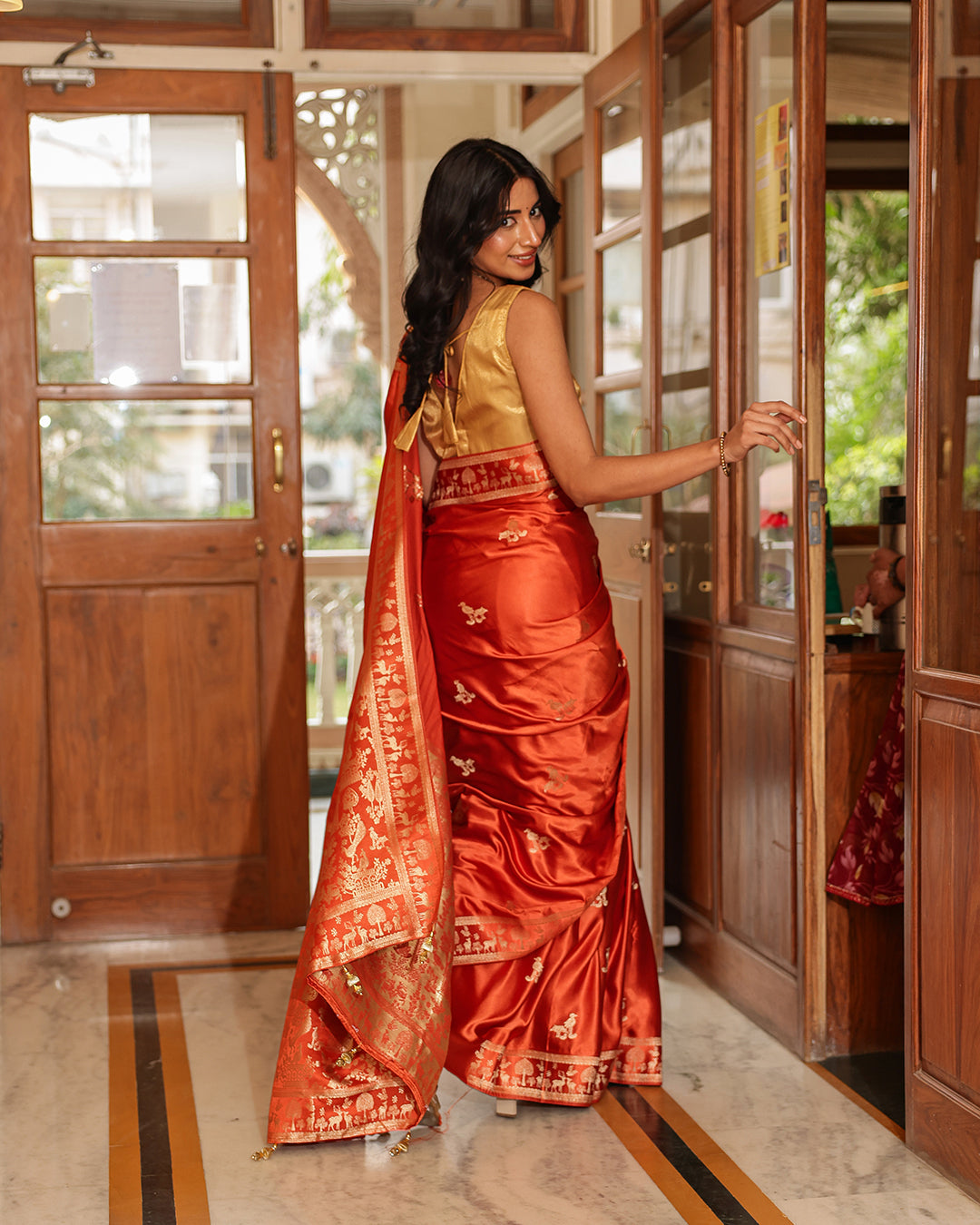 Rust Orange Dola Silk Animal Motif Saree